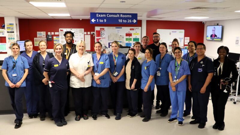 Emergency care team standing together to highlight performance target.