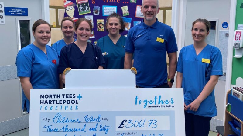 Gordon Mitchell presents cheque to children's ward