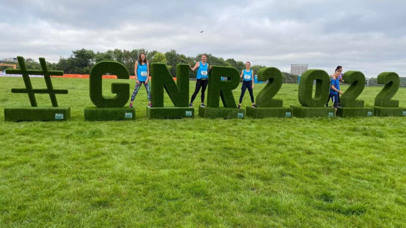 Runners pose with the Great North Run sign.